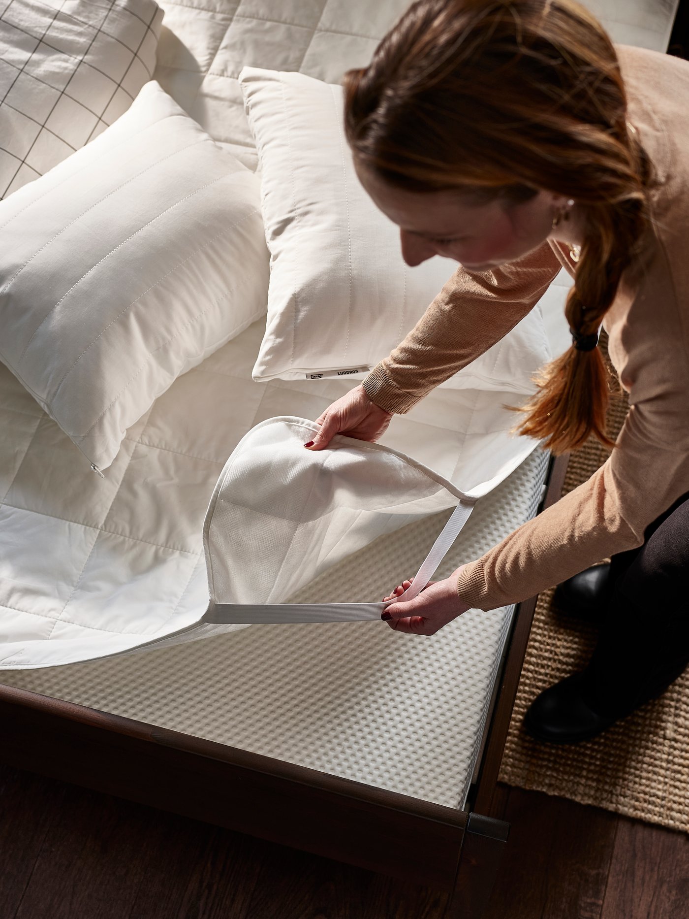 A firm/white ÅBYGDA foam mattress