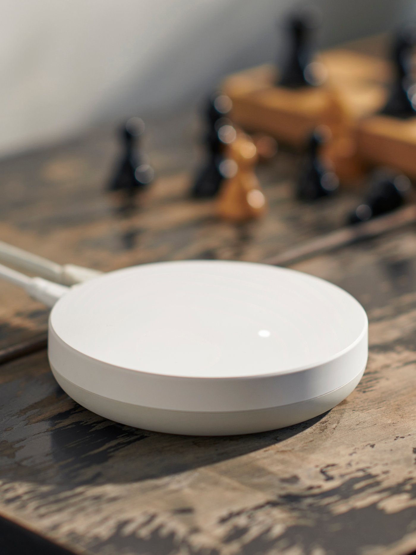 A white smart DIRIGERA hub for smart products