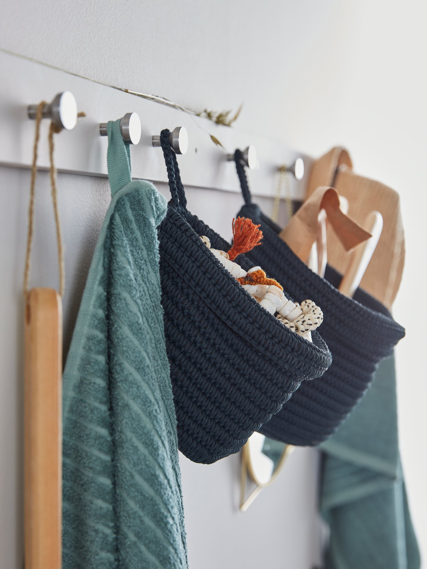 Baskets hanging on a coat rack