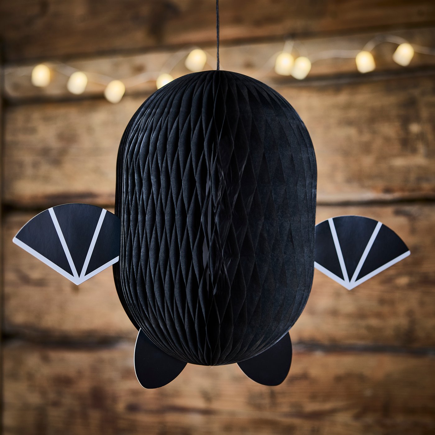 A battery-operated outdoor/ghost white KUSTFYR LED lighting chain with 12 lights in the living room