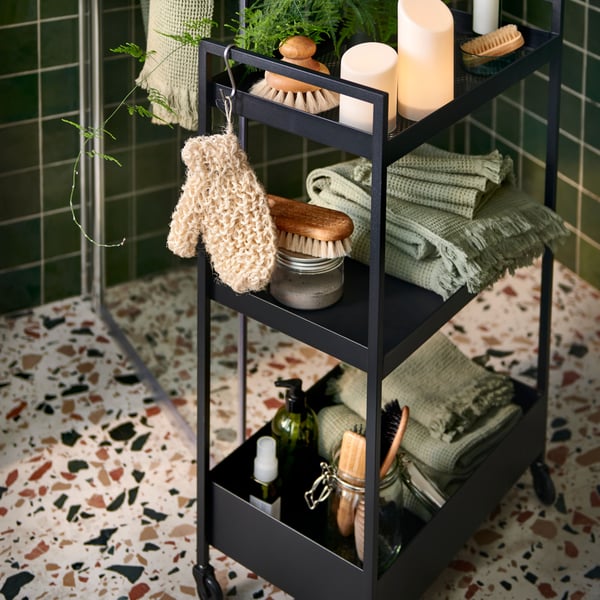 An ÄDELLÖVSKOG LED block candle in/out in the bathroom