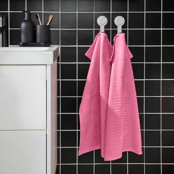 A pink VÅGSJÖN hand towel