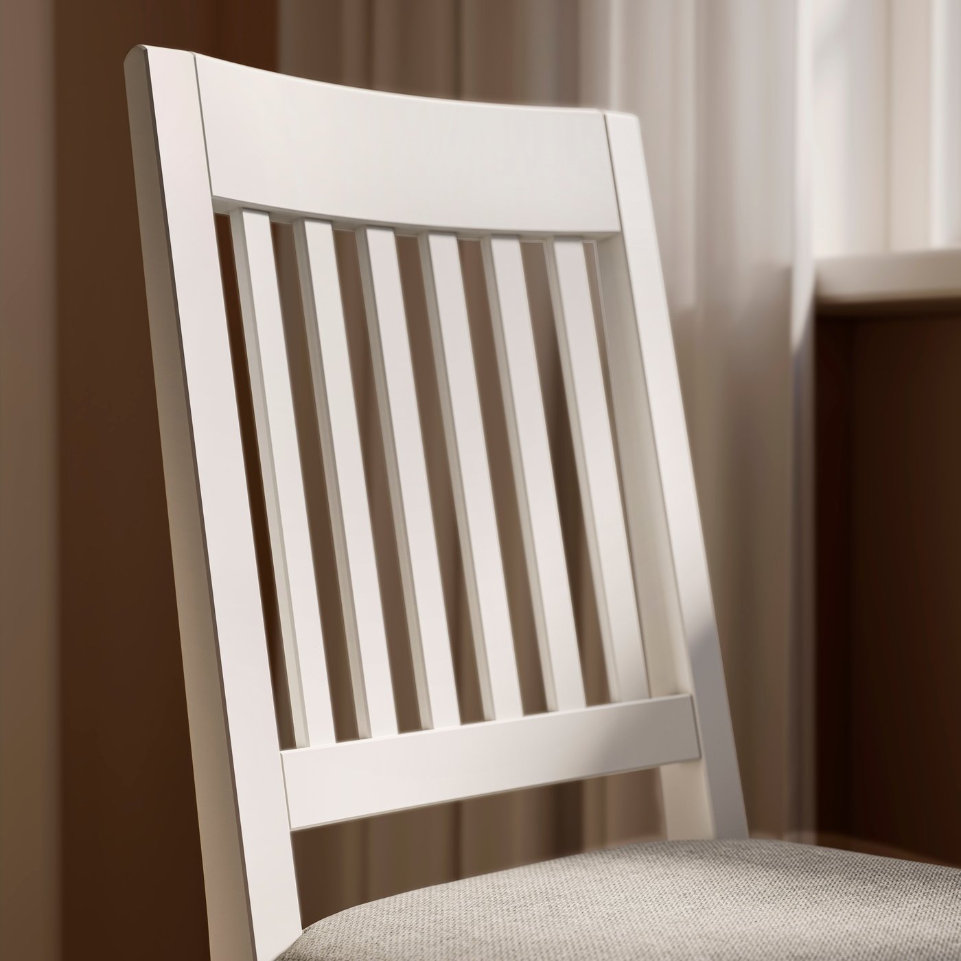 A close-up of the back of a white NÄSINGE chair with a padded seat with a beige-grey cover.