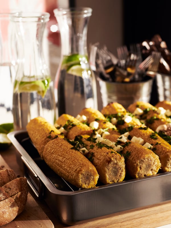 A stainless steel KONCIS roasting tin with grill rack in the kitchen