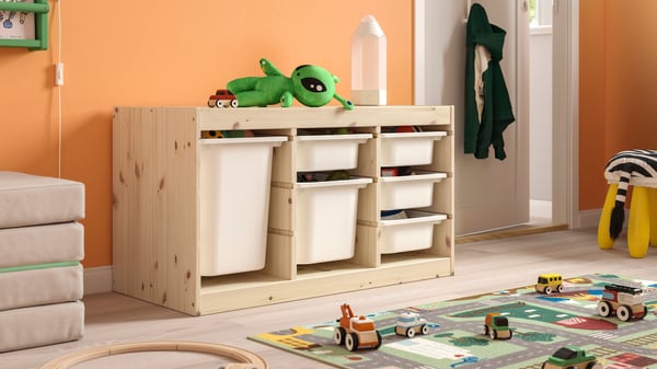 A light white stained pine TROFAST frame in the childrens room