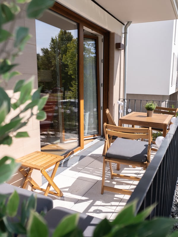 A light brown stained NÄMMARÖ table, outdoor