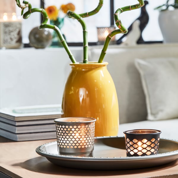 An anthracite BERGGRAN candle holder in the living room