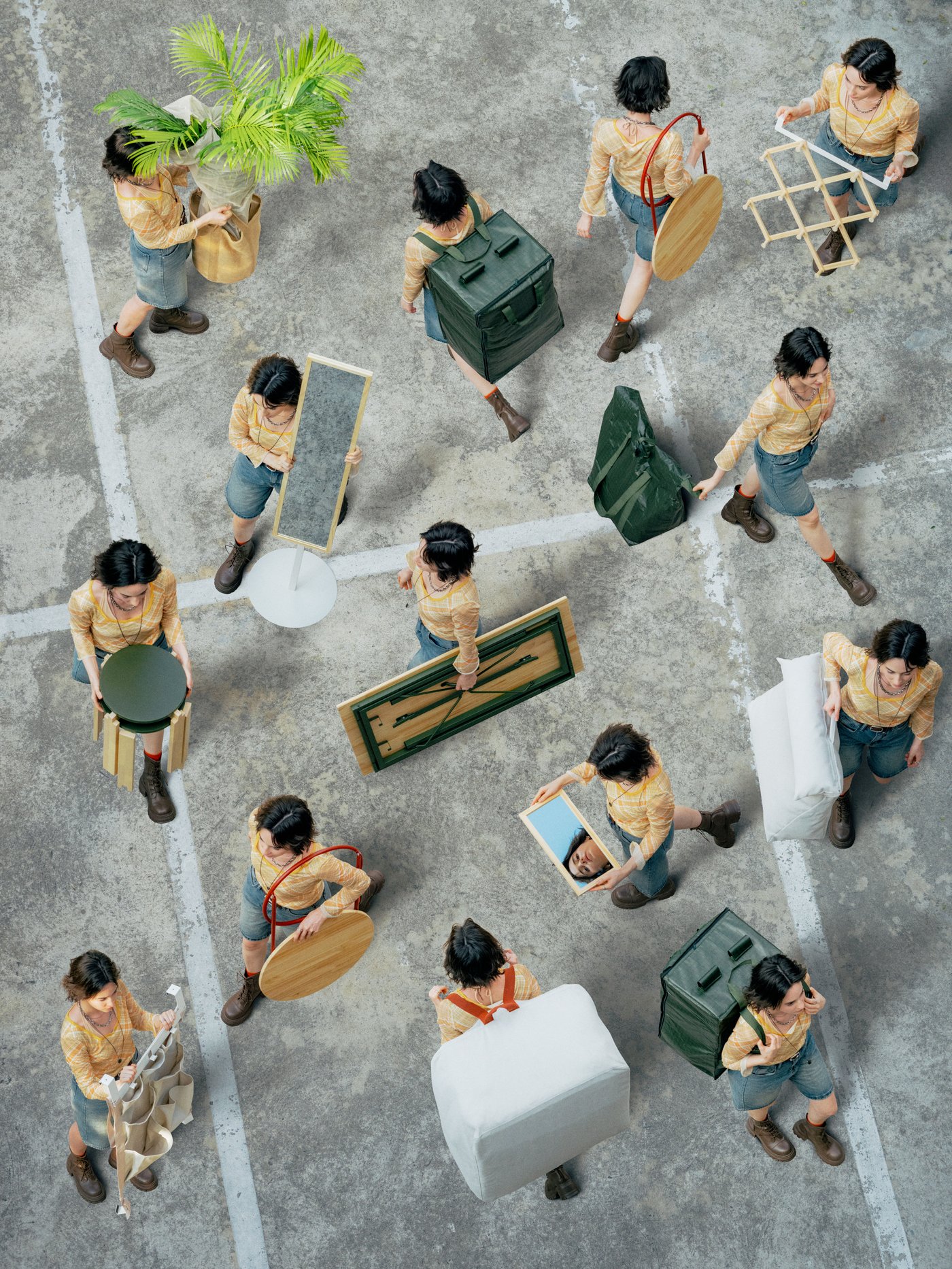 Top view of a group of people walking in different directions while carrying items from the collection.
