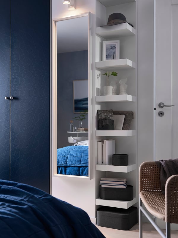 A white LACK wall shelf unit in the bedroom