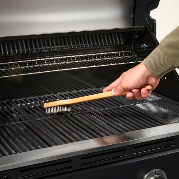 A stainless steel/beech GRILLTIDER barbecue grill cleaning brush