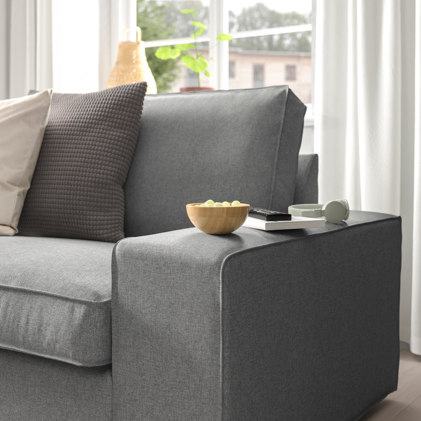A Tibbleby beige/grey KIVIK 2-seat sofa in the living room