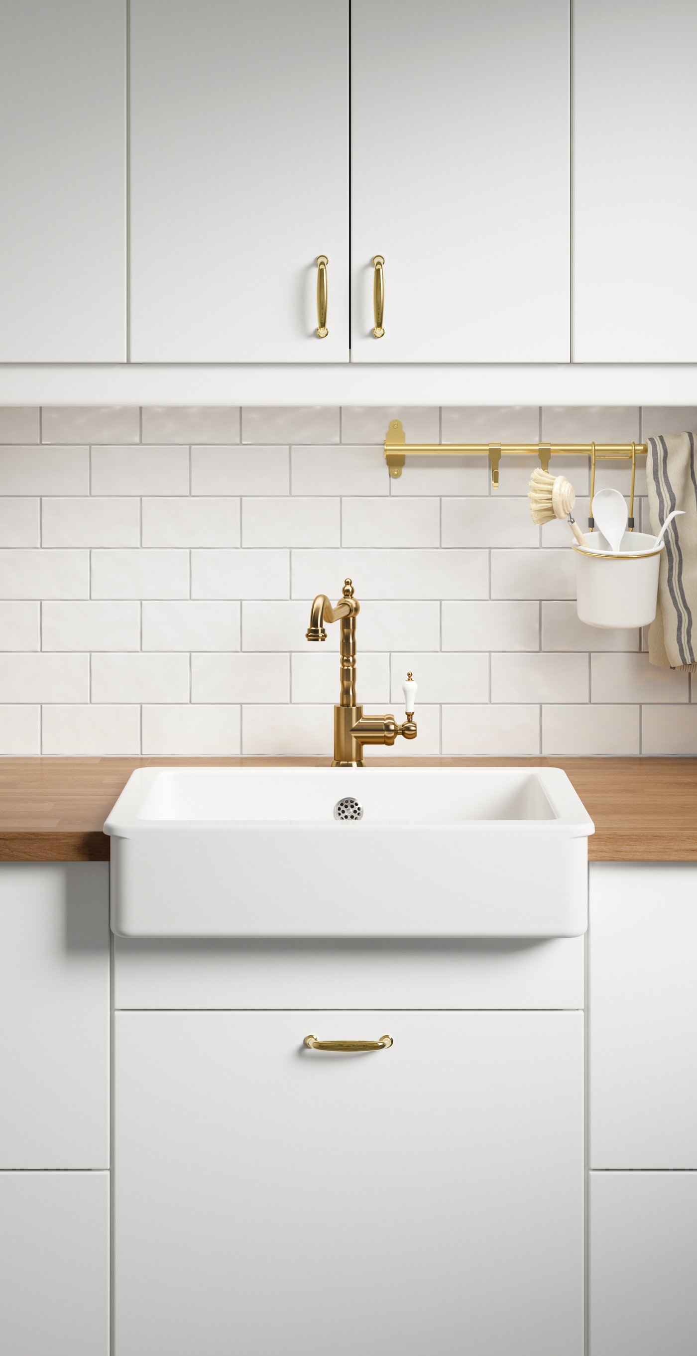 Sink with white rim installed in a kitchen with white fronts and wooden worktop