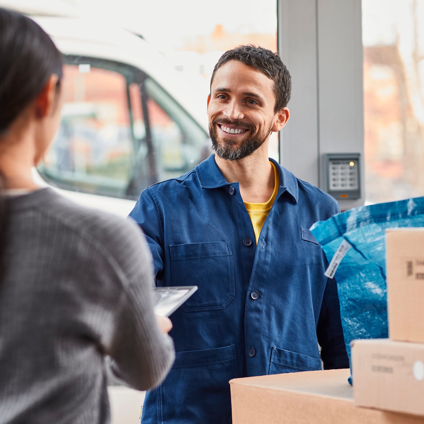 IKEA worker delivers boxes to a customer