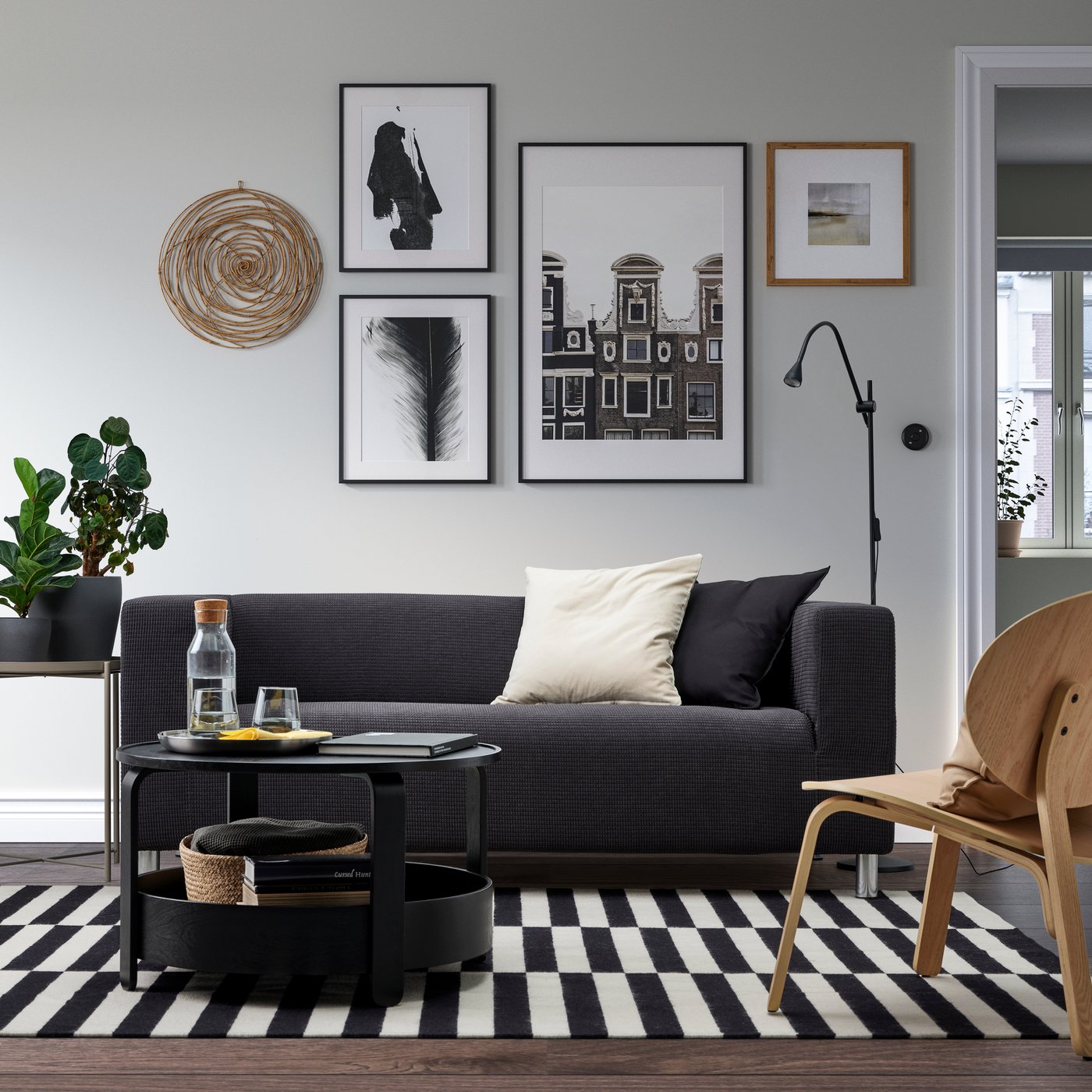A Vissle grey KLIPPAN 2-seat sofa in the living room