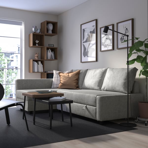 A Faringe light grey FRIHETEN seat section for corner sofa-bed in the living room