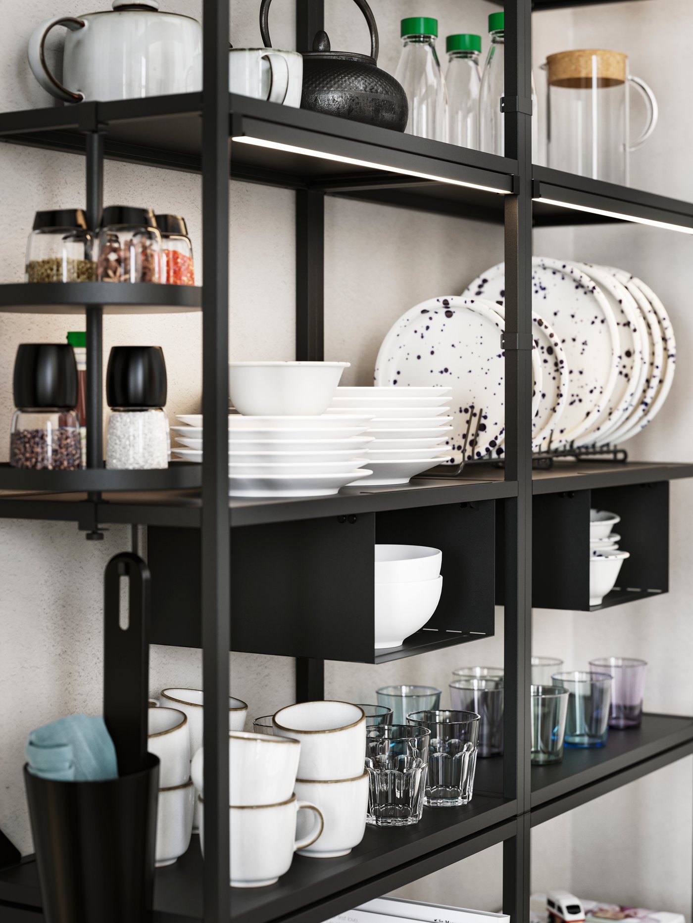 Two anthracite ENHET high frames with shelves holding various tableware, plus an anthracite ENHET swivel shelf with spices.