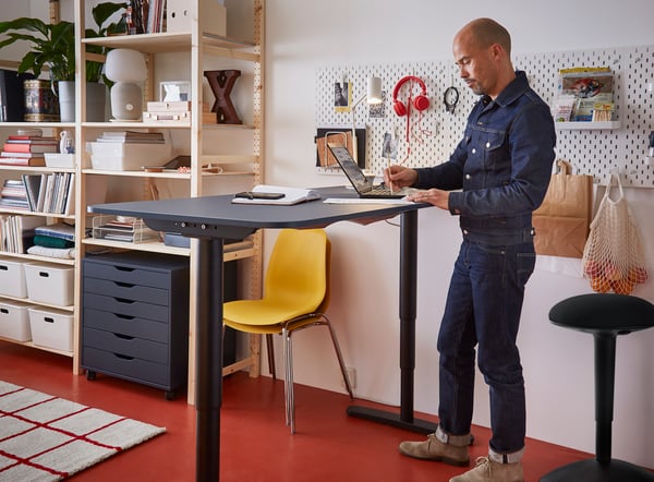 A linoleum blue/black BEKANT desk sit/stand