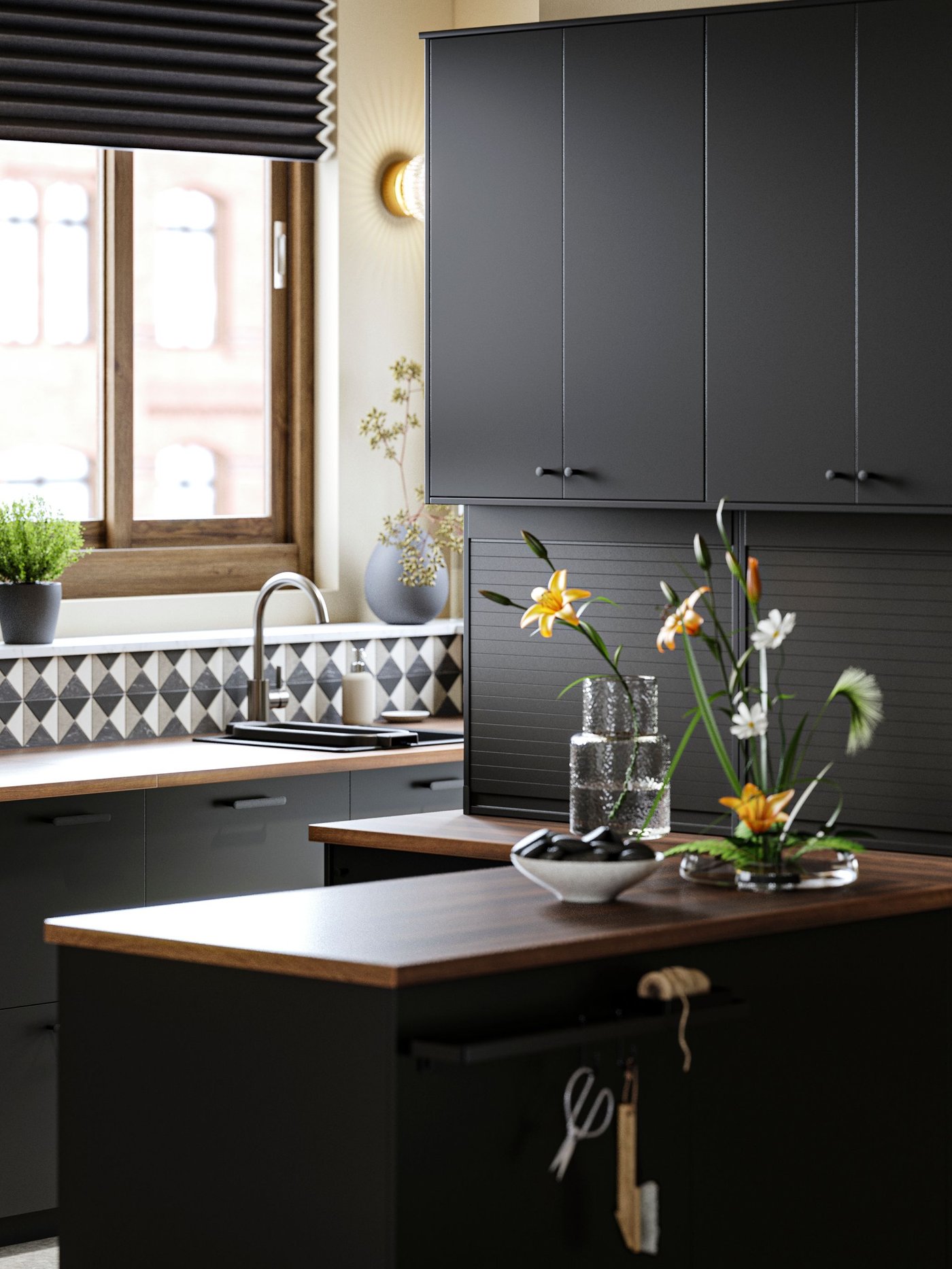 A pewter effect DELSJÖN kitchen mixer tap in the kitchen
