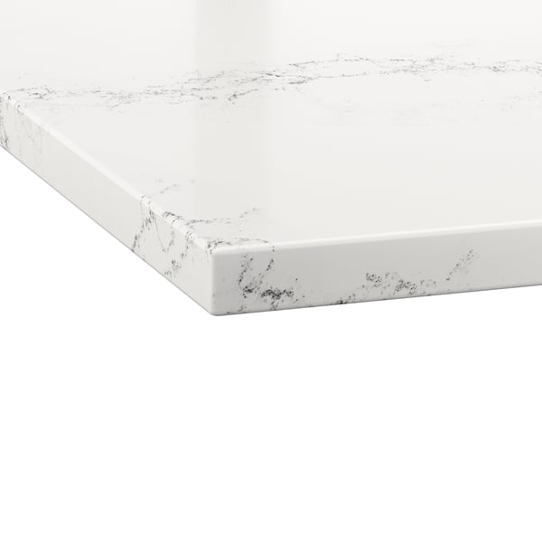 Close-up of a white marble-look countertop with light gray veining and a glossy, polished finish.