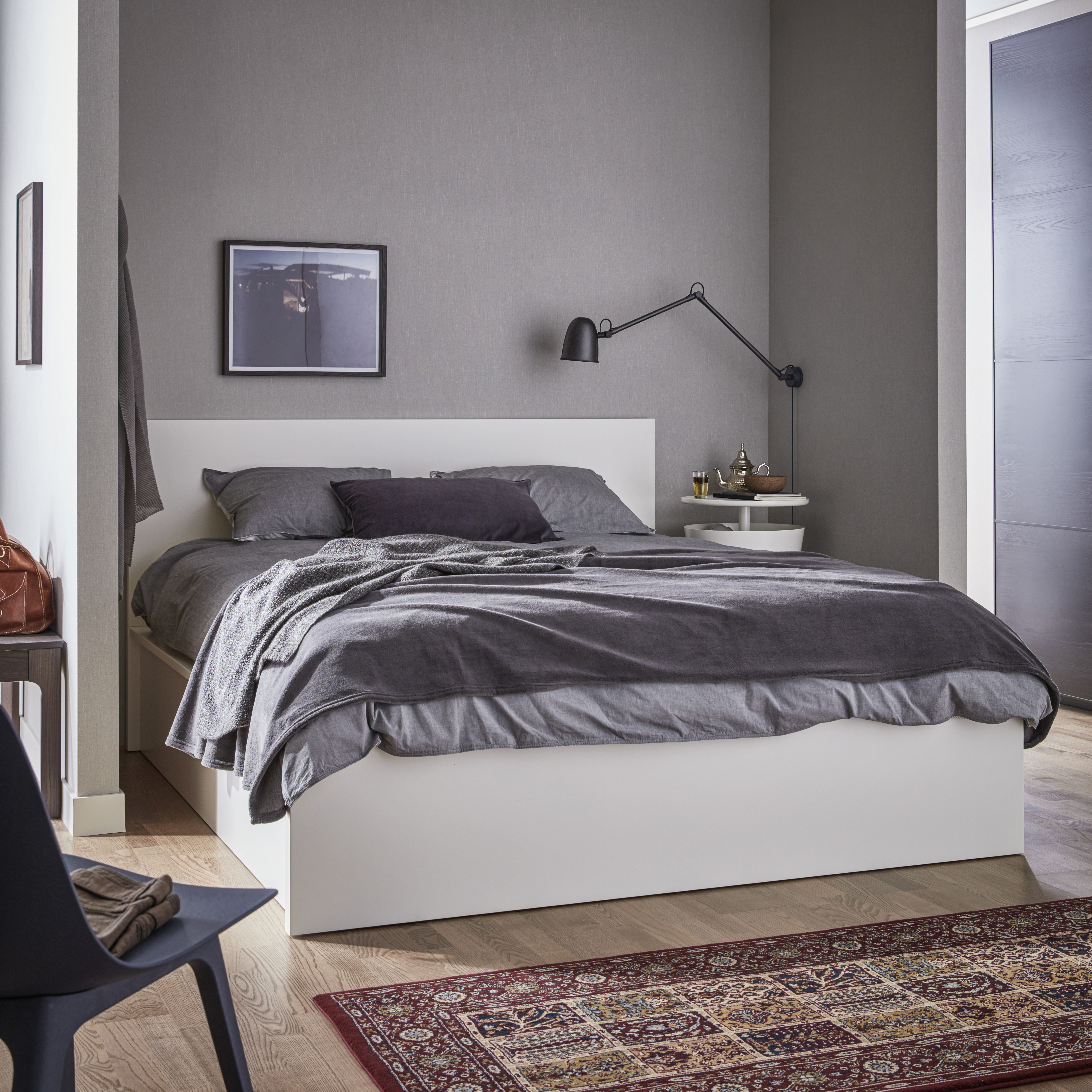 A white MALM ottoman bed in the bedroom