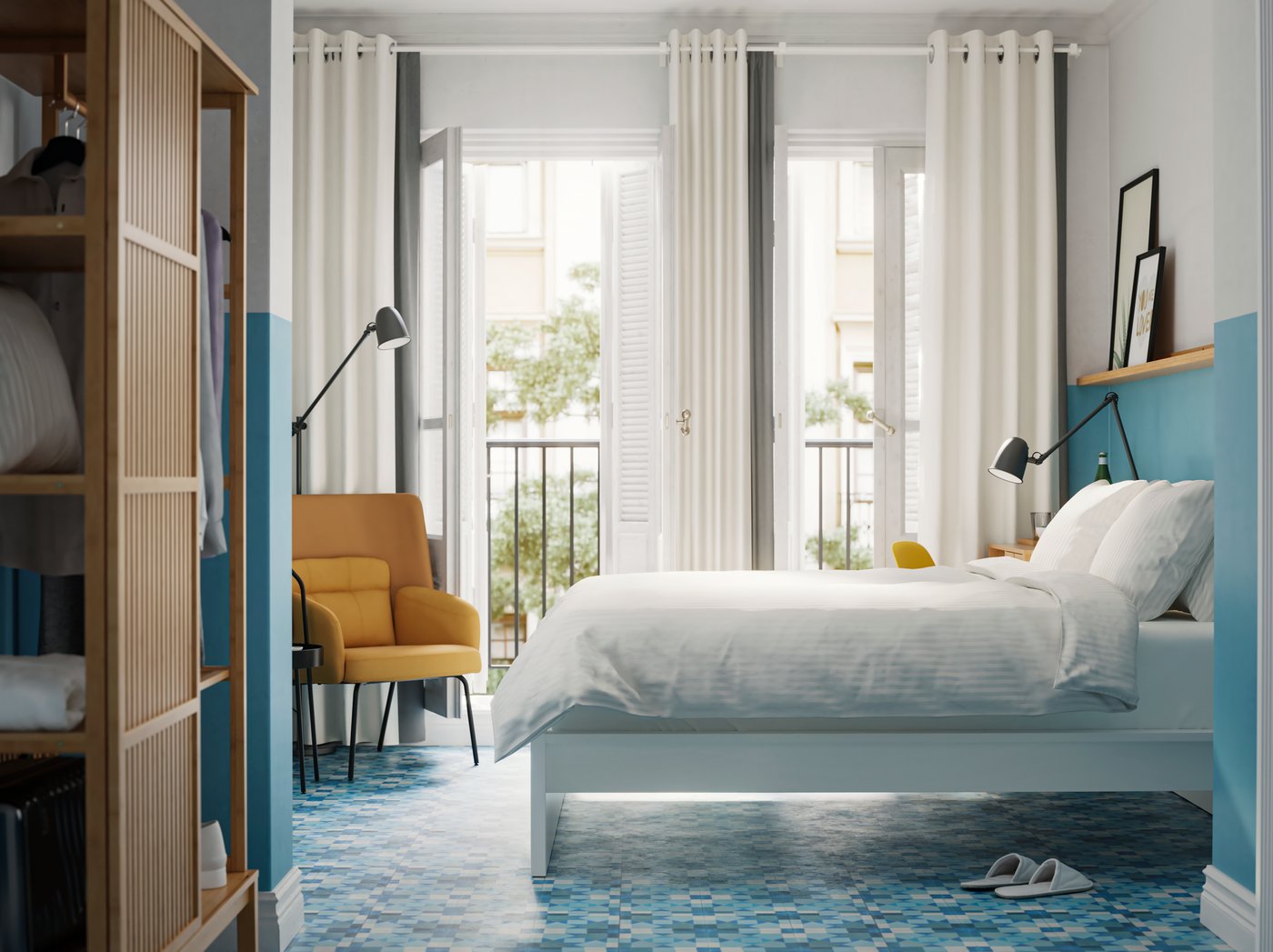 A bedroom with NORDKISA wardrobe in bamboo, a white bed with white bedlinen, blue walls and floors and a yellow armchair.