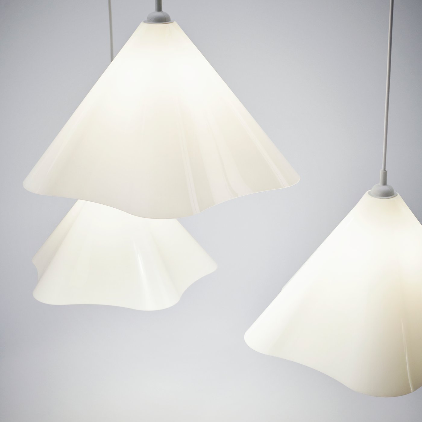 White plastic ZEBRASÄV ceiling lights against a light background.