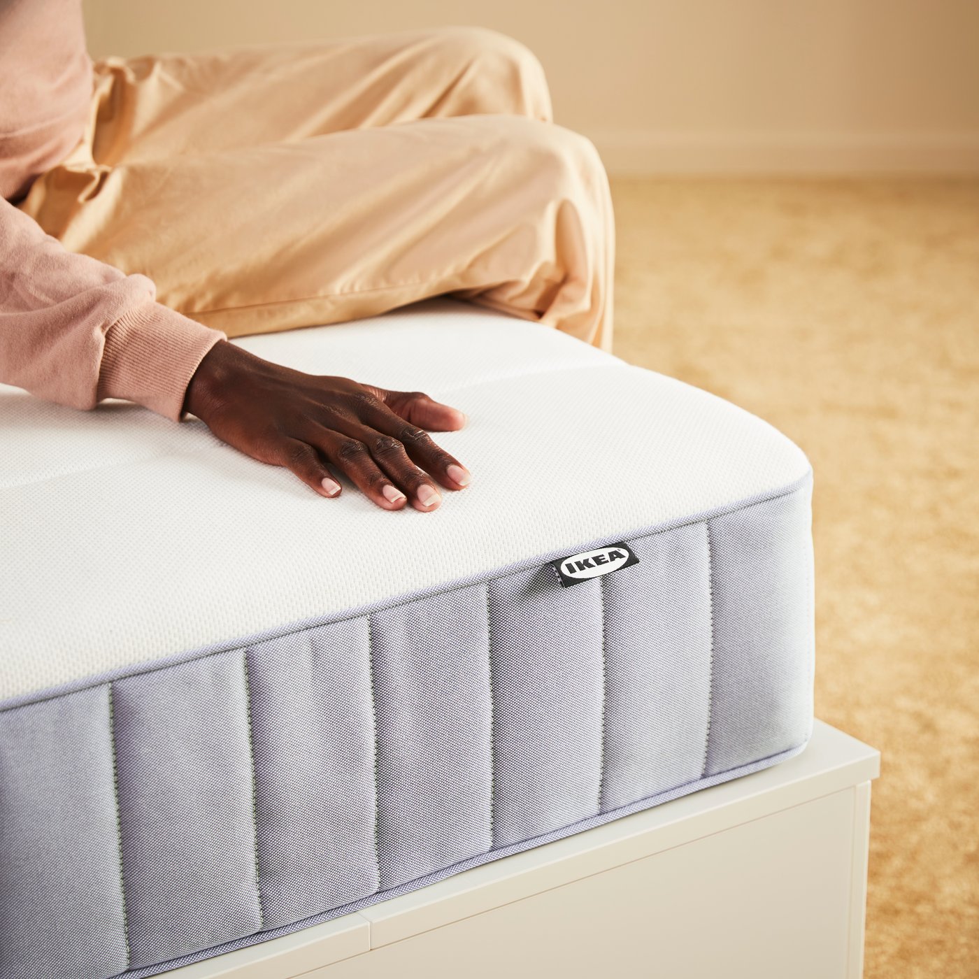 A firm/light blue VESTERÖY pocket sprung mattress