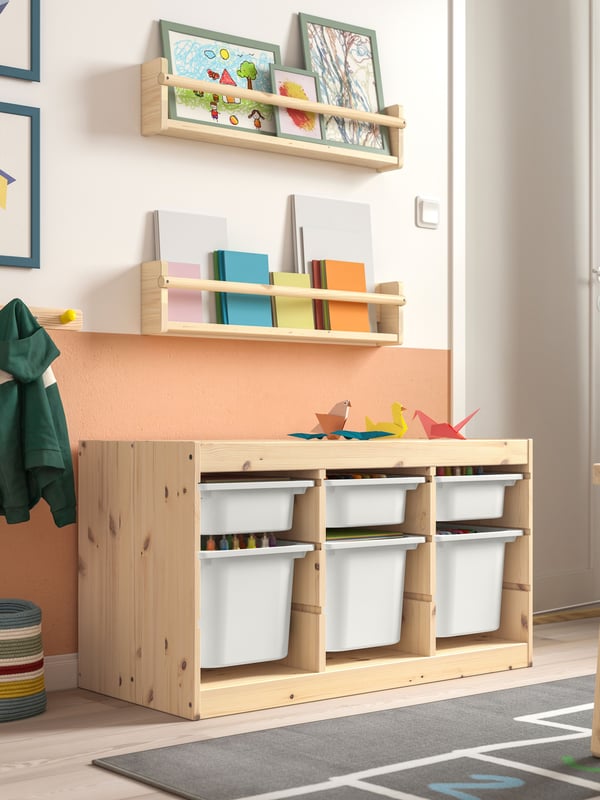 A light white stained pine FLISAT wall storage in the childrens room