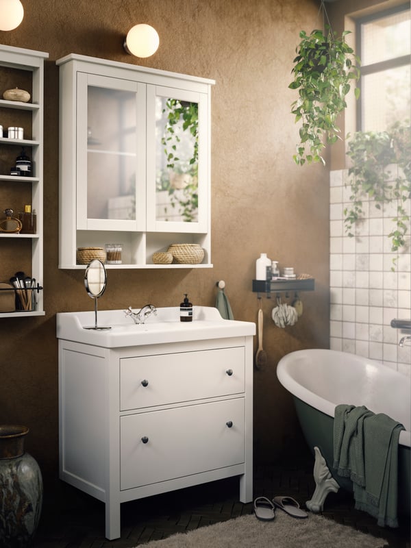 A bathroom featuring a HEMNES mirror cabinet, HEMNES sink and TRENSUM mirror.