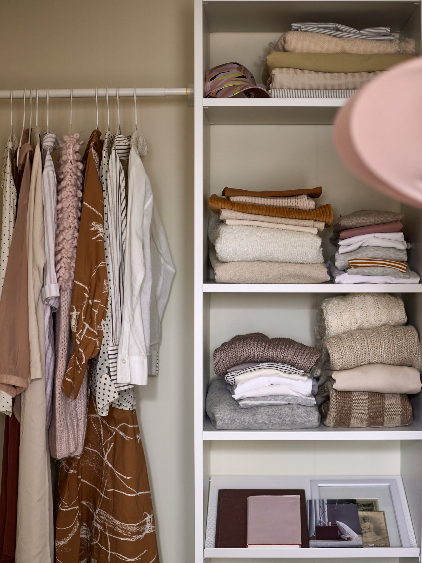 A white AURDAL wardrobe combination in the bedroom