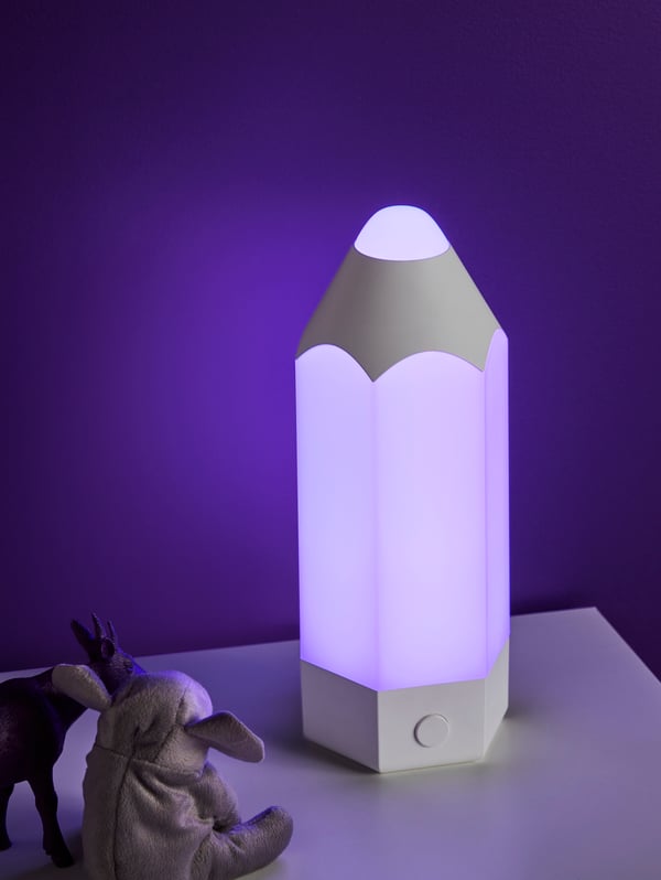 A multicolour PELARBOJ LED table lamp in the childrens room