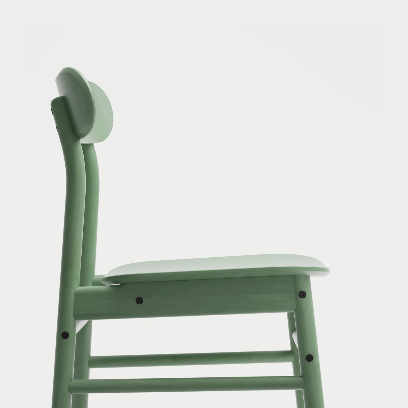 A green dining chair against a light background.