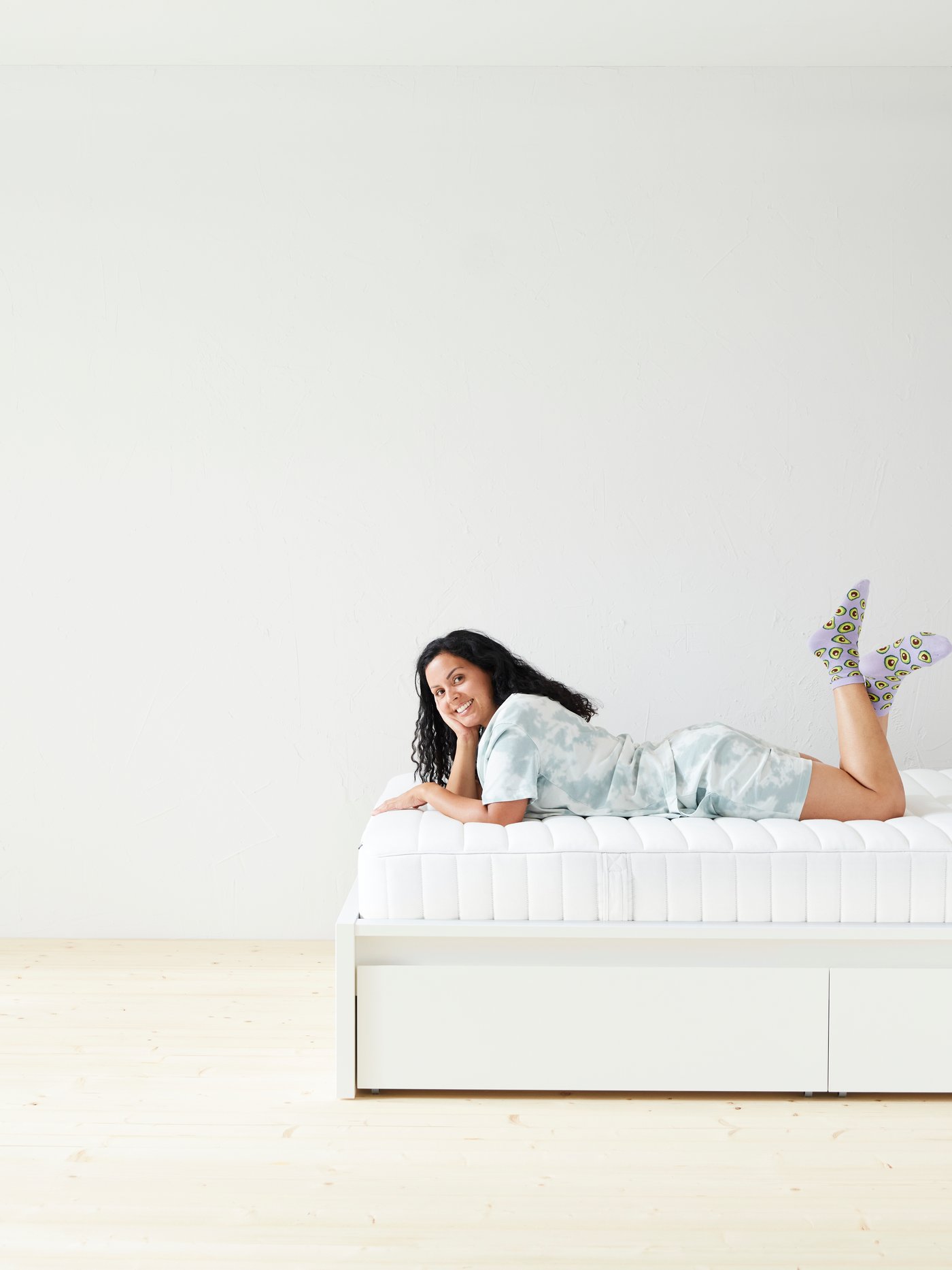 A firm/white VALEVÅG pocket sprung mattress