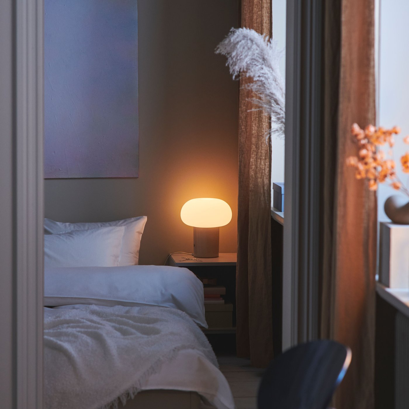 An off-white EVALI throw in the bedroom