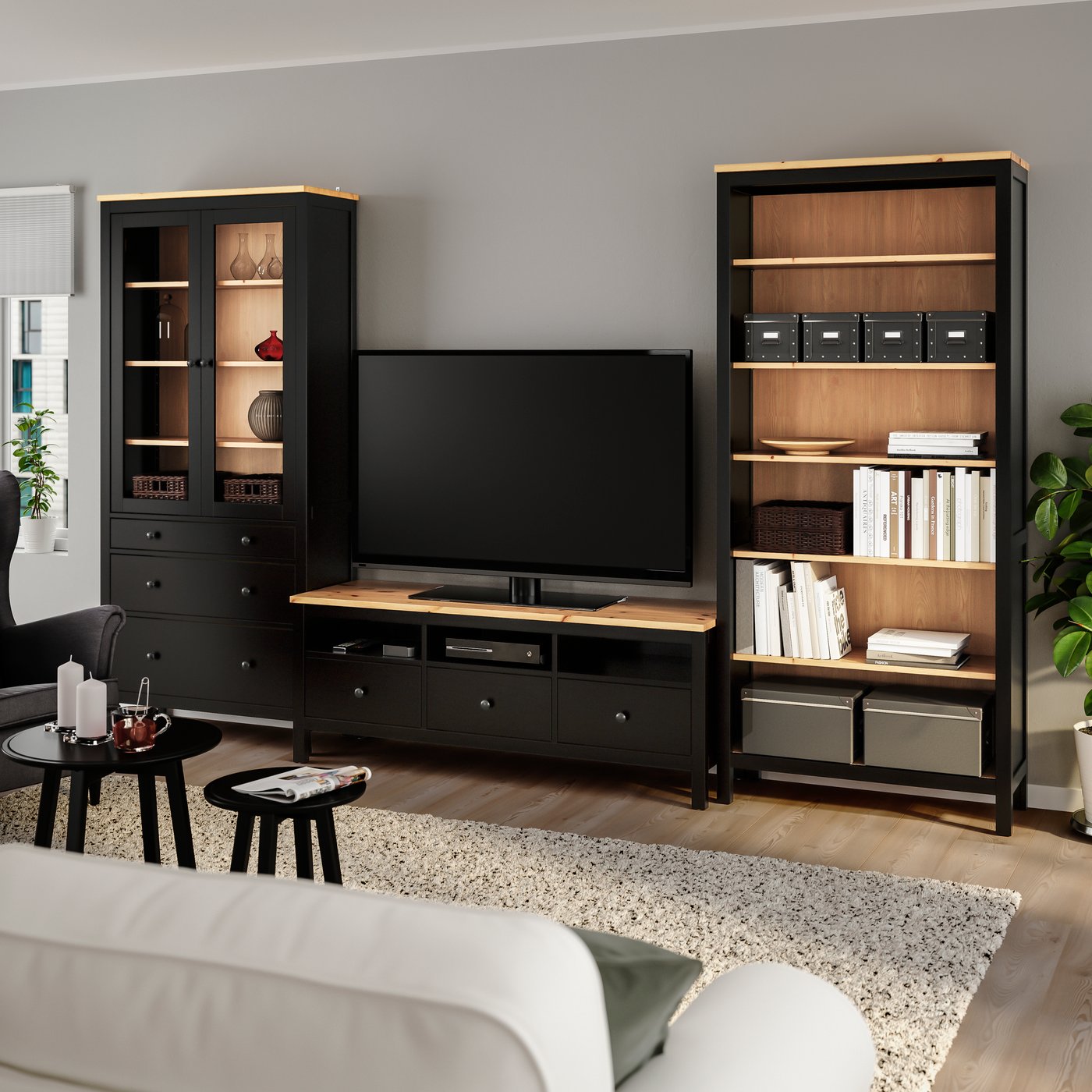 A black-brown/light brown clear glass HEMNES TV storage combination