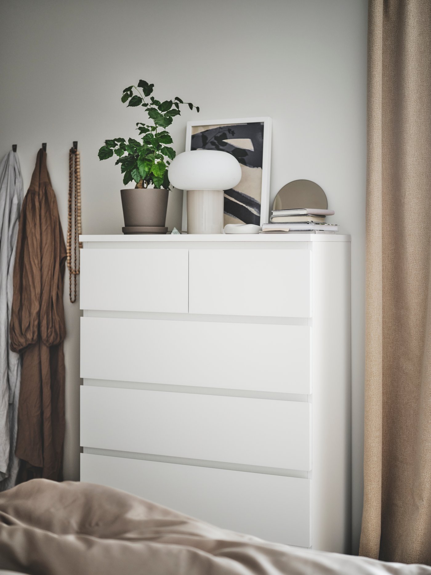 A beige/opal white glass DEJSA table lamp in the bedroom
