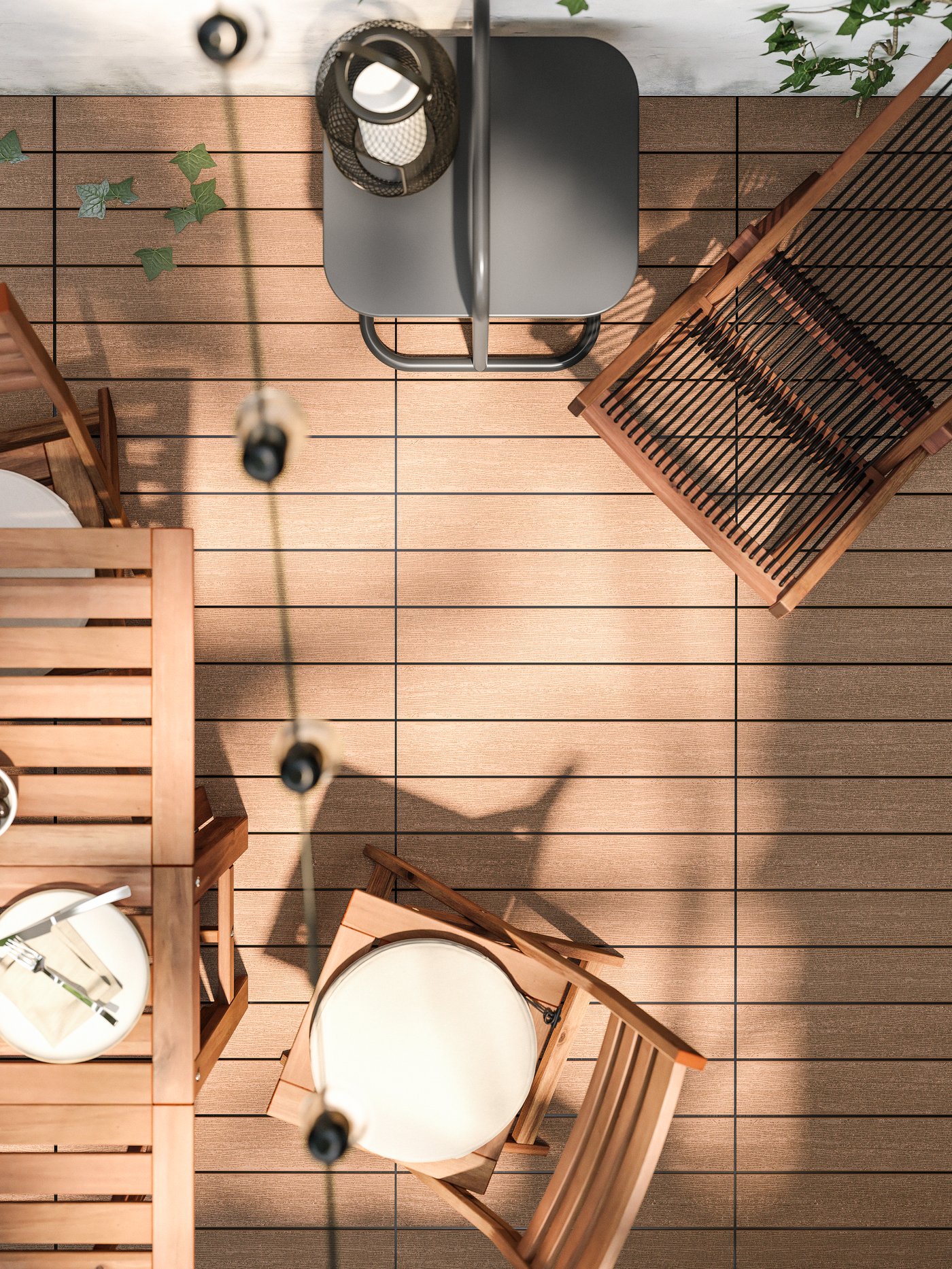 Wood-like floor decking with a wooden outdoor dining set, wooden lounger and a side table surrounding it.