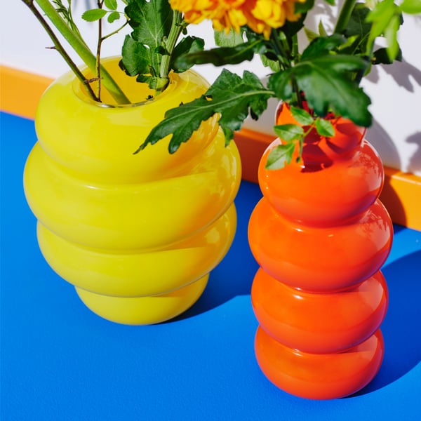 An orange KÄLLARHALS vase