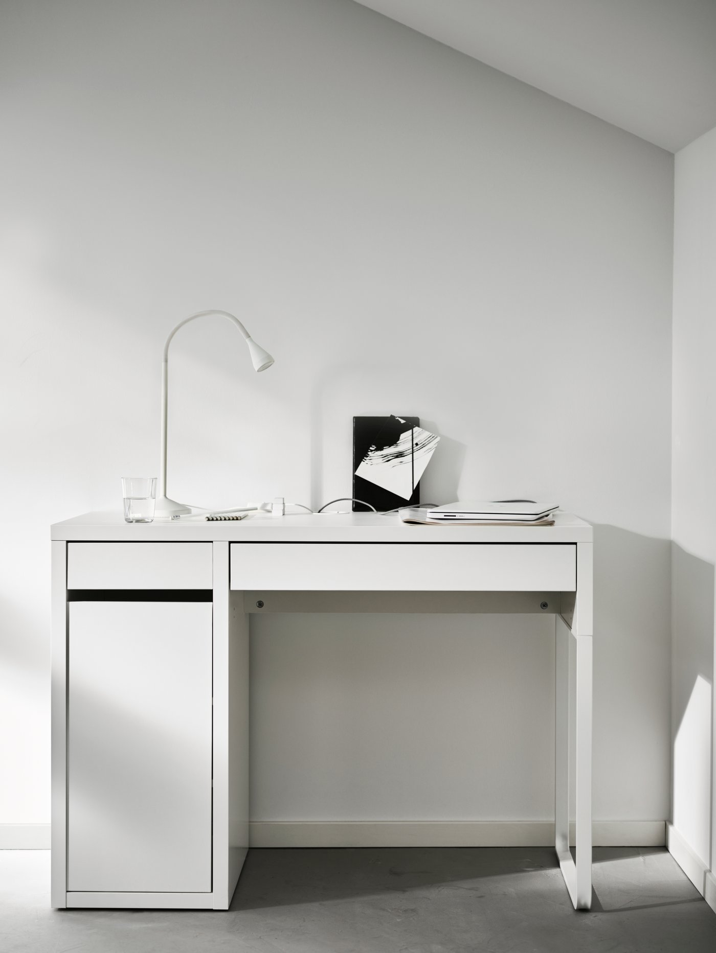 A white NÄVLINGE LED work lamp