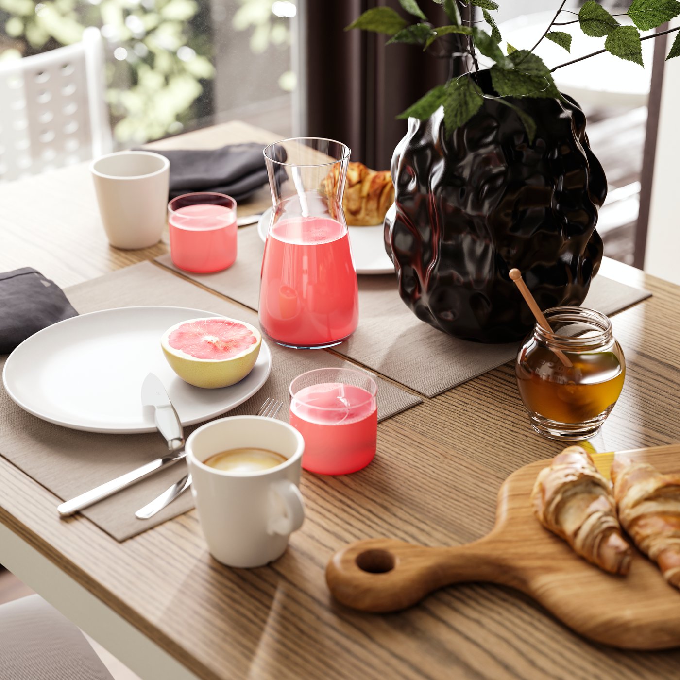 En brunchdukning för två, med kaffe, juice, färsk frukt och croissanter, är placerad på ett utdragbart ÅLHULT-bord.