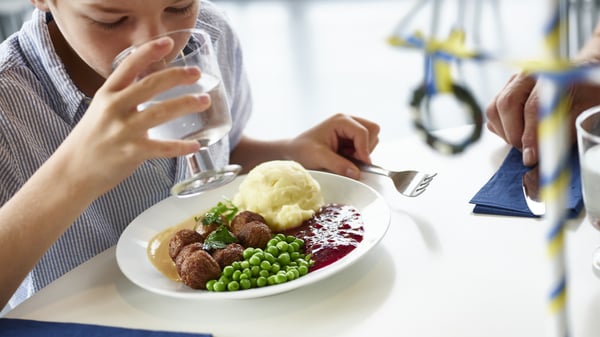 A person eating meatball