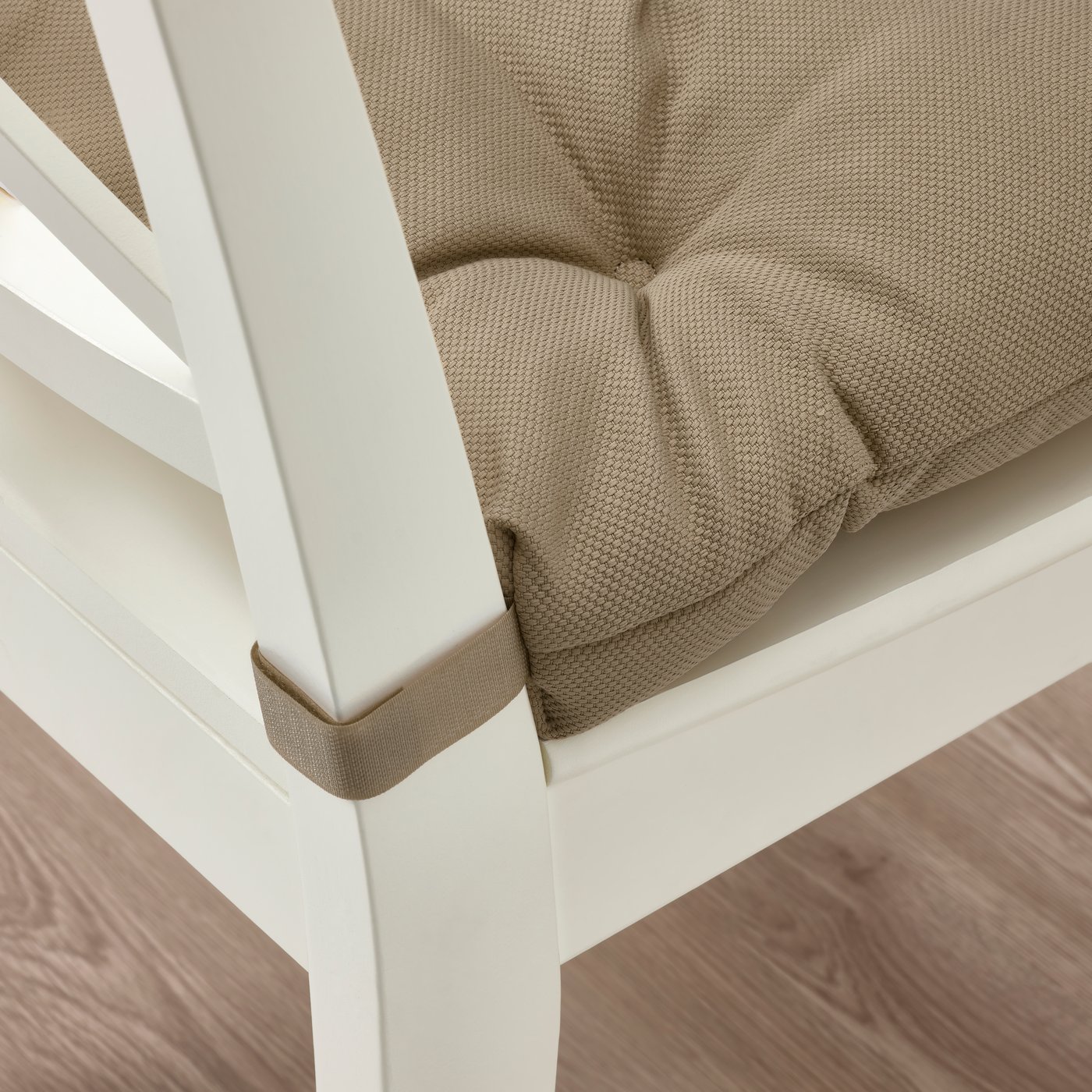 A beige MALINDA chair cushion
