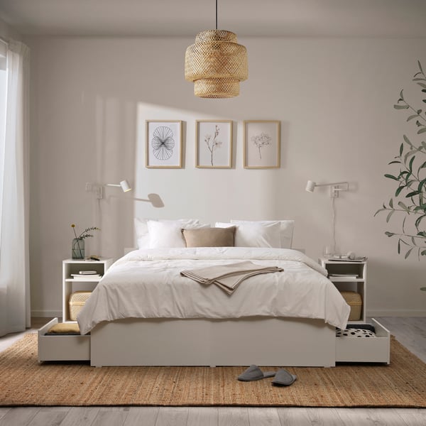 A white/Luröy VIHALS bed frame with 4 storage boxes in the bedroom