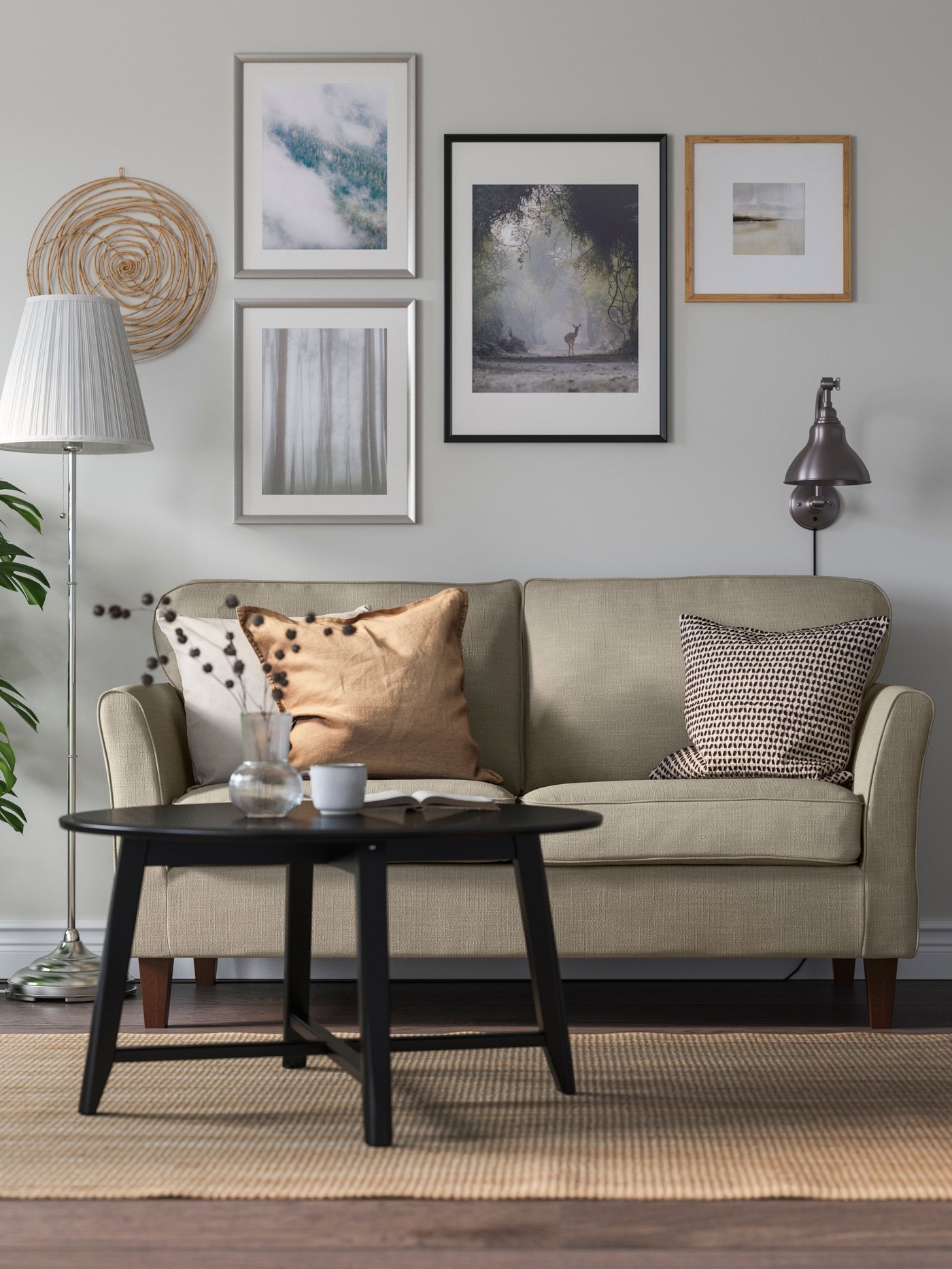 A nickel-plated/white ÅRSTID floor lamp in the living room