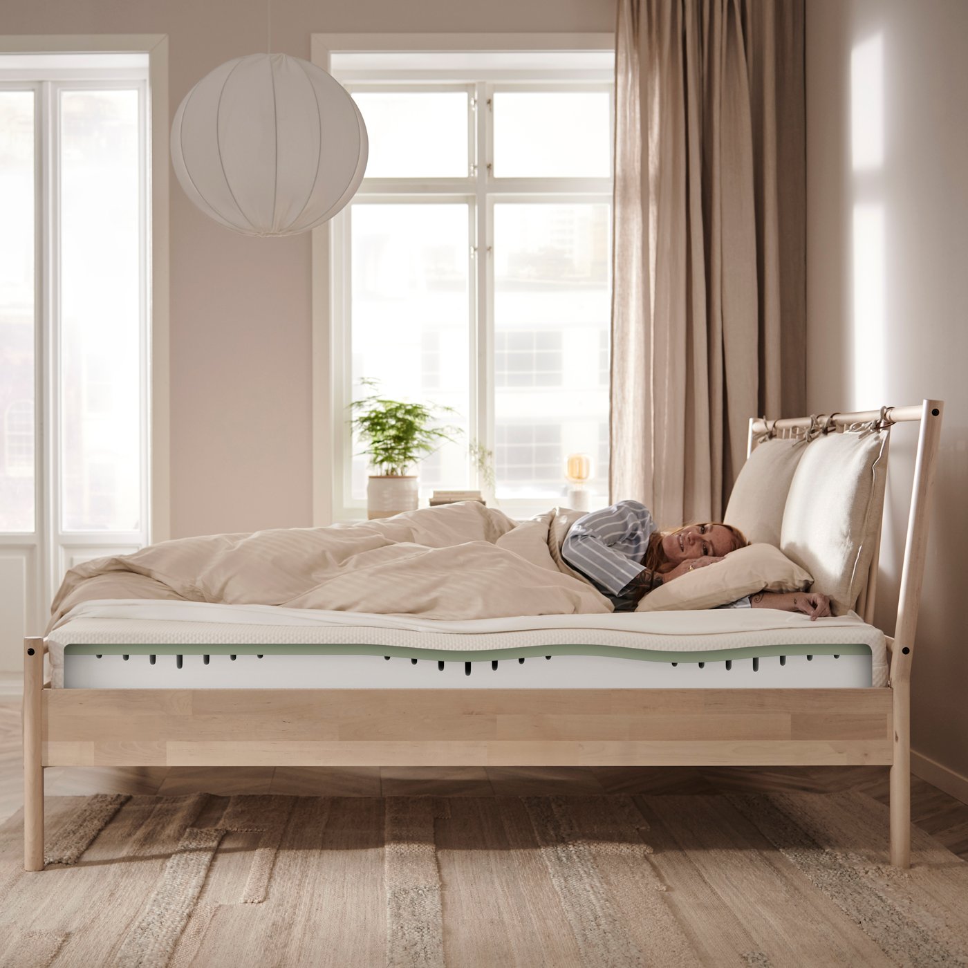 A firm/white ÅBYGDA foam mattress