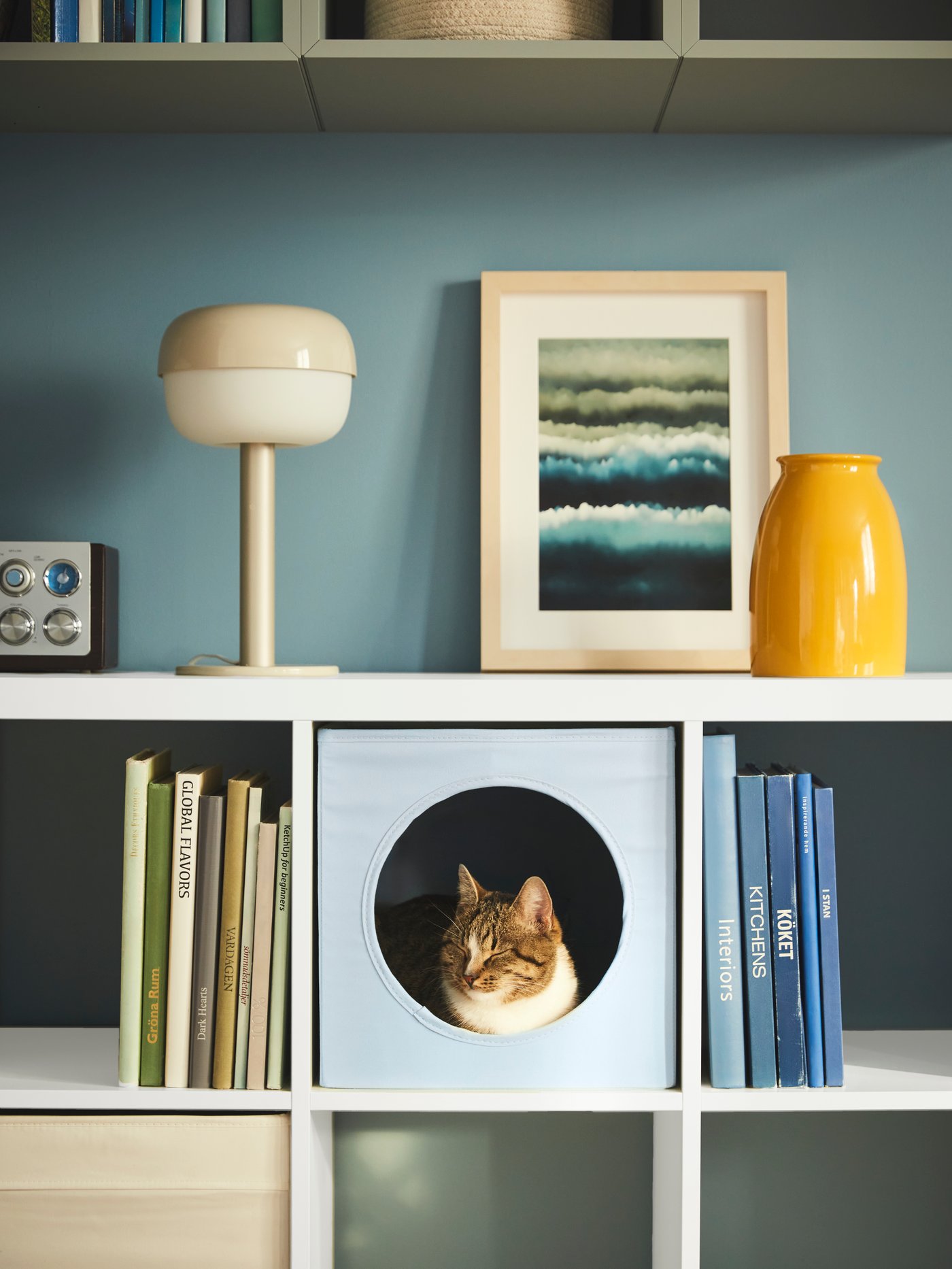 A white KALLAX shelving unit in the living room