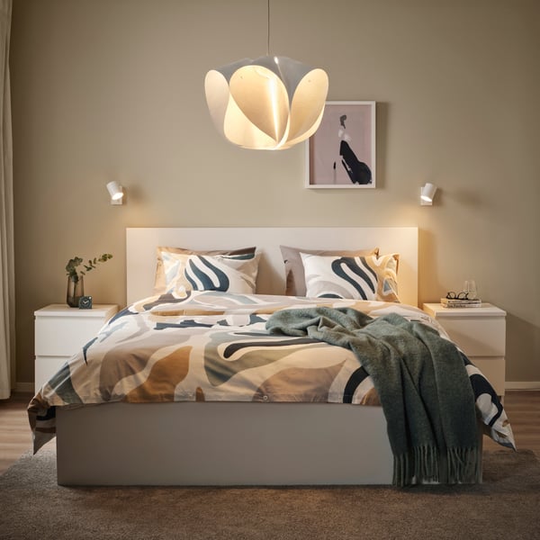 A white BÄCKNATE pendant lampshade