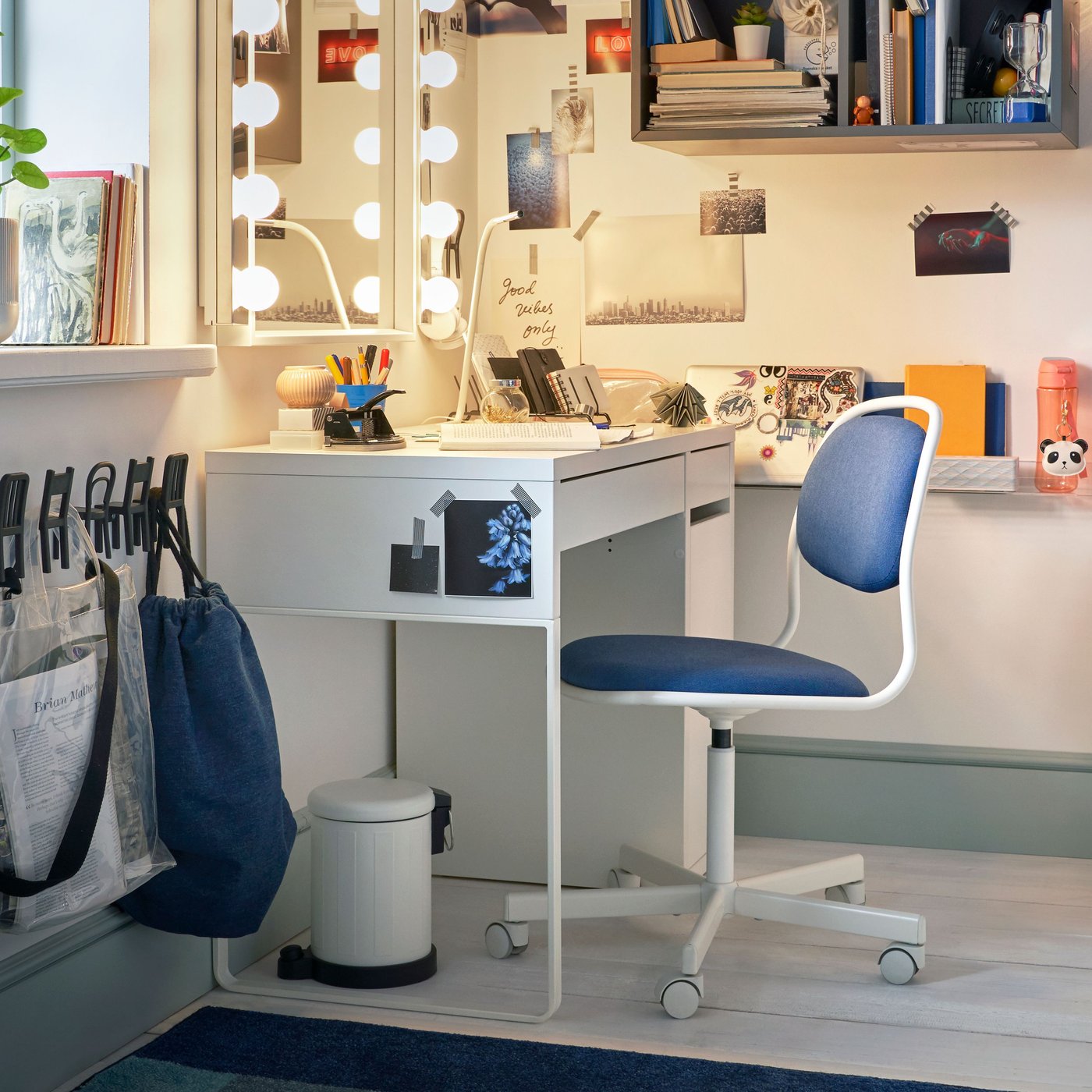 A white/Vissle dark blue ÖRFJÄLL swivel chair in the home office