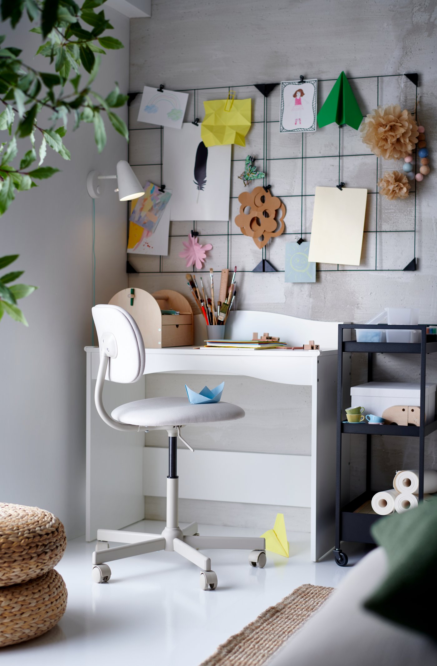 A white FUBBLA LED wall lamp in the home office