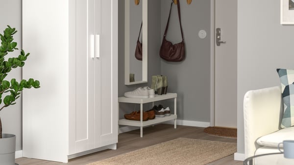 A white BRIMNES wardrobe with 2 doors in the hallway